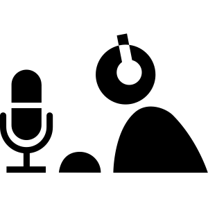 person recording audio at a microphone
