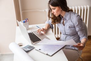 woman working on her computer independently