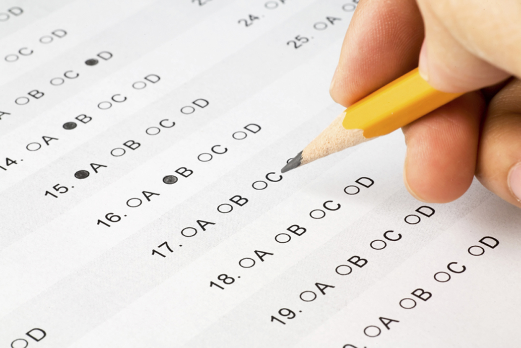 hand completing a multiple choice exam.