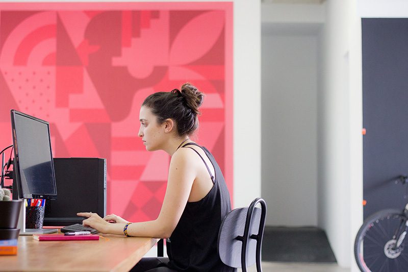 woman at a computer using a keyboard