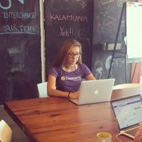 CourseArc Employee working at desk
