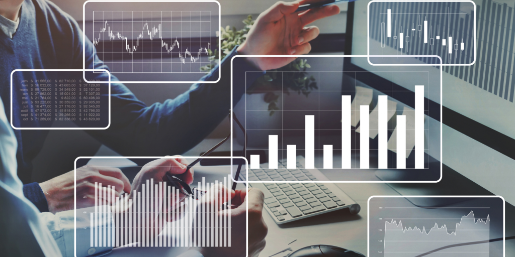 man's arm pointing at computer screen with statistical and data graphics overlaid on top