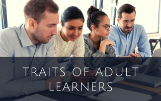Adult learners working together on laptop