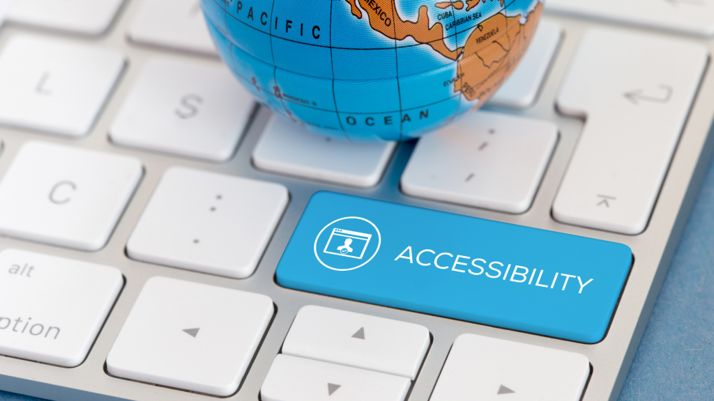 small globe sitting on keyboard with large blue accessibility key