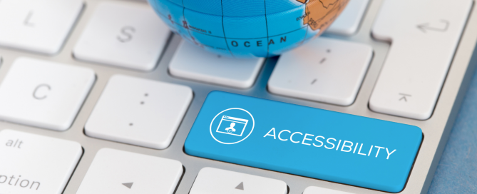 small globe sitting on keyboard with large blue accessibility key