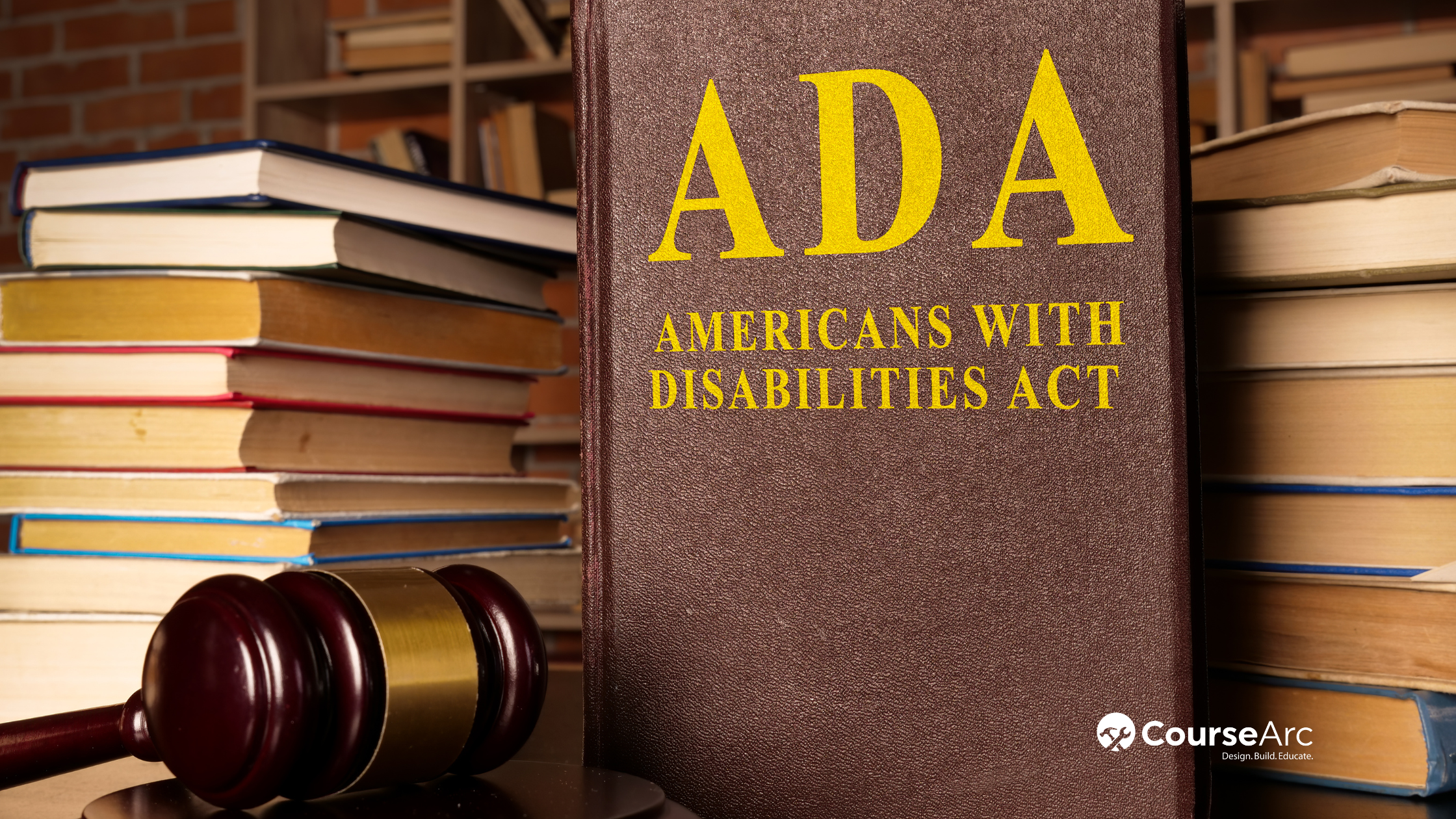 Gavel and Americans with Disabilities Act (ADA) textbook with documents on a table.